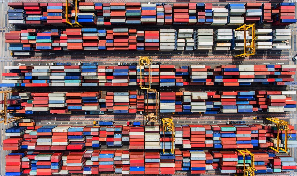 DM Containers port facility with stacked shipping containers